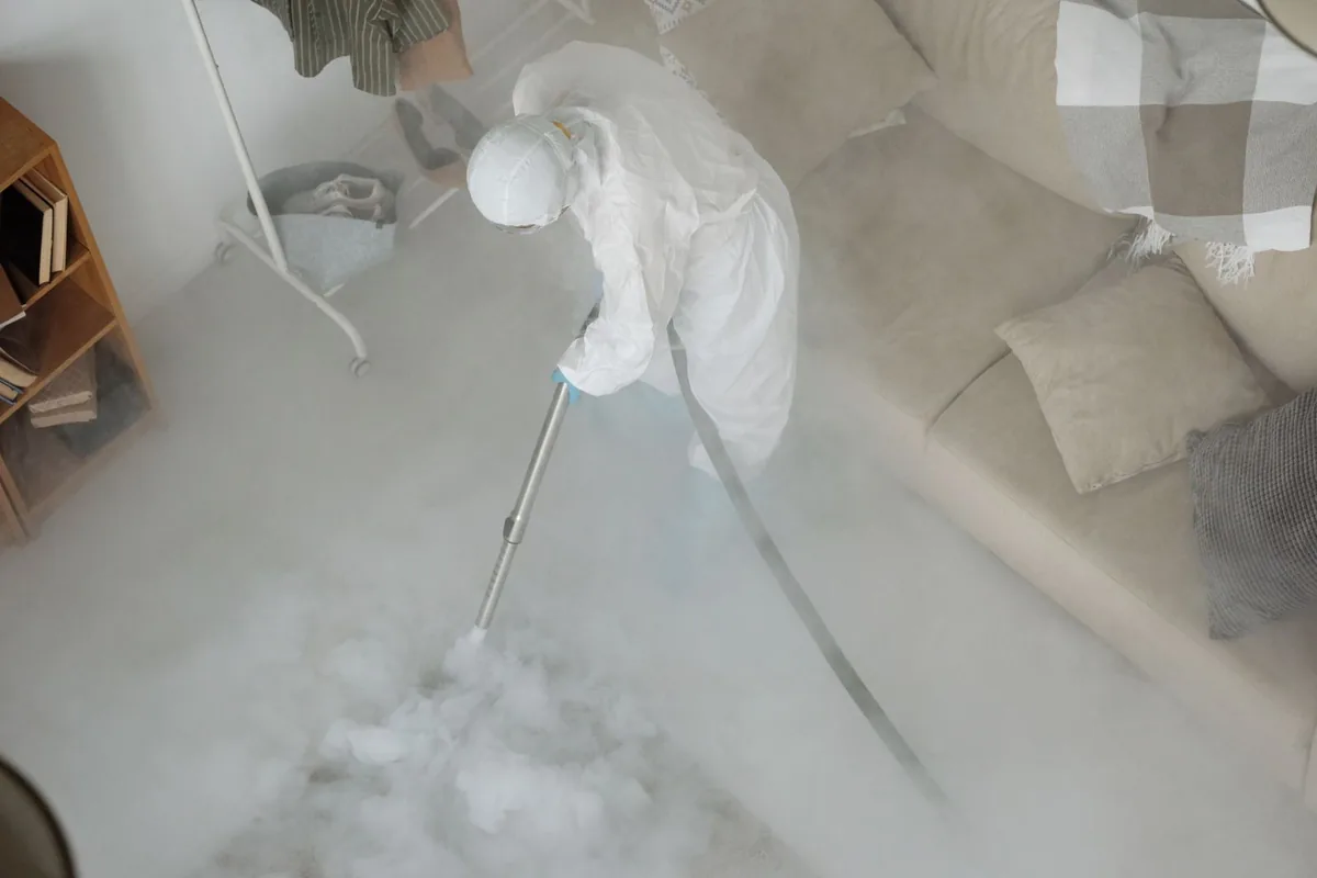 Biohazard cleanup technician in protective equipment, Lake Barcroft, VA